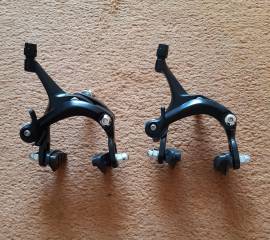 Új két forgáspontú alu patkófék szett. Ár/szett. Benyúlás kb. 44-58mm.  .  Országúti / Gravel / Triatlon Alkatrész, Országúti Fék / Fékváltókar mechanikus nem használt ELADÓ